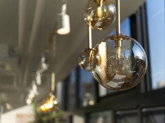 A series of lighted glass globes hang from the ceiling