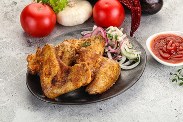 Grilled chicken wings with sauce