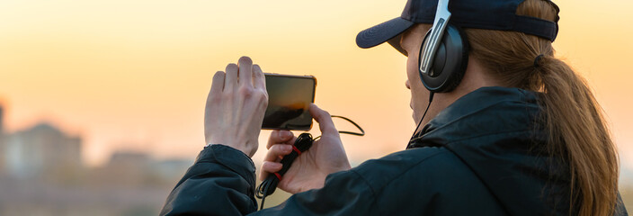 A man takes a picture on the phone, stock photo