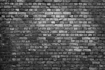 gray wall made of old brick close-up