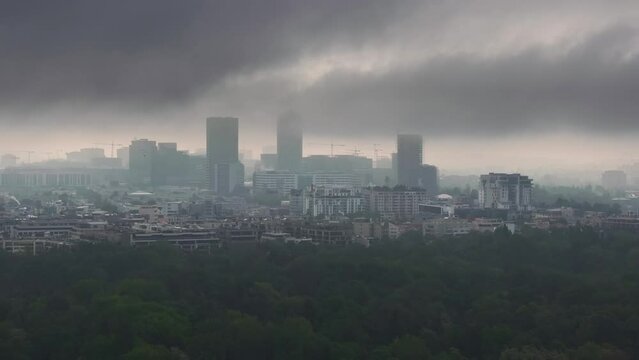 Bucharest from above. Aerial 4K video during a foggy morning in north part of Bucharest, view to Free Press House (Casa Presei Libere in Romanian) and office skyscraper buildings in Romania.