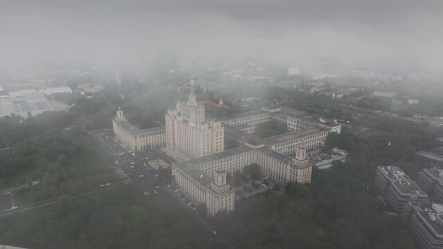 Bucharest from above. Aerial 4K video during a foggy morning in north part of Bucharest, view to Free Press House (Casa Presei Libere in Romanian) and office skyscraper buildings in Romania.