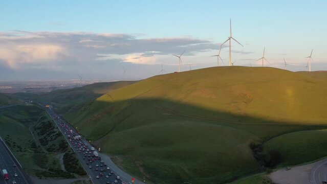 Aerial View of Wind Turbines on nearby hillside