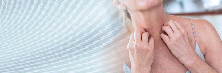 Woman having itchy and scratching her arm; panoramic banner