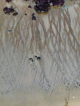 Low Tide Reveals Textured Sands at Arrigunaga Beach