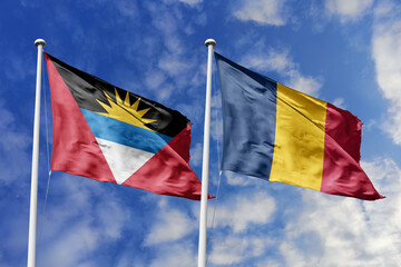  3d illustration. Antigua and Barbuda and Chad Flag waving in sky. High detailed waving flag. 3D render. Waving in sky. Flags fluttered in the cloudy sky.
