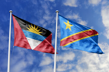  3d illustration. Antigua and Barbuda and Democratic Republic of the Congo Flag waving in sky. High detailed waving flag. 3D render. Waving in sky. Flags fluttered in the cloudy sky.
