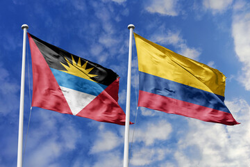  3d illustration. Antigua and Barbuda and Colombia Flag waving in sky. High detailed waving flag. 3D render. Waving in sky. Flags fluttered in the cloudy sky.