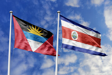  3d illustration. Antigua and Barbuda and Costa Rica Flag waving in sky. High detailed waving flag. 3D render. Waving in sky. Flags fluttered in the cloudy sky.