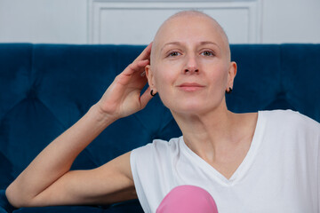 Portrait of confident strong woman with no hair, cancer survivor
