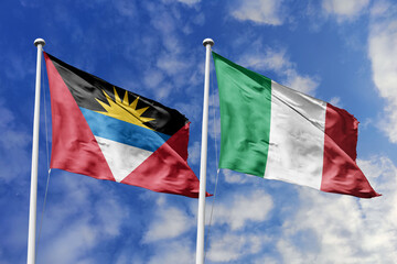  3d illustration. Antigua and Barbuda and Italy Flag waving in sky. High detailed waving flag. 3D render. Waving in sky. Flags fluttered in the cloudy sky.