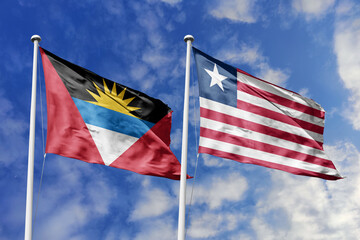  3d illustration. Antigua and Barbuda and Liberia Flag waving in sky. High detailed waving flag. 3D render. Waving in sky. Flags fluttered in the cloudy sky.