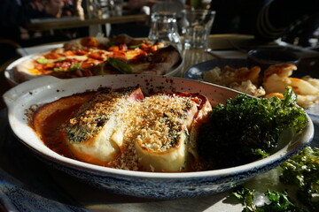 Close up Traditional Pepperoni and cheese Pizza served with cheesy eggplant and bread toast