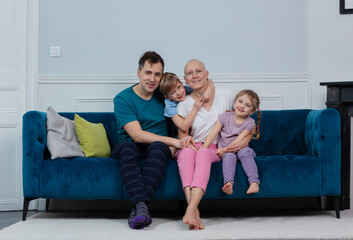 Loving family support patient woman with no hair ill of cancer