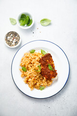 Fototapeta premium Baked white fish with pepper sauce