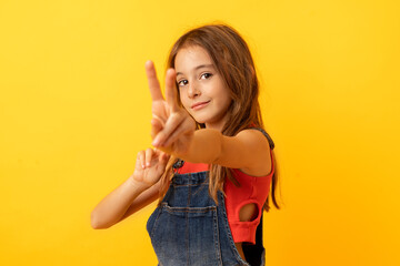 Girl showing victory gesture