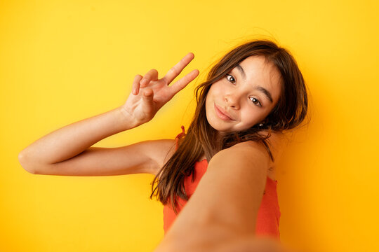 Girl taking self portrait with mobile phone