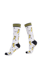 Subject shot of white socks with color banana pattern, black toes and heels and striped cuffs. The...