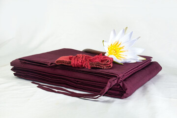 Kāṣāya are the robes of fully ordained Buddhist monks. In Sanskrit and Pali cīvara. constructed of discarded fabric. antarvasa, uttarasanga and samghati together they forms "triple robe,"