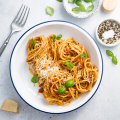 Pasta with red pesto and basil