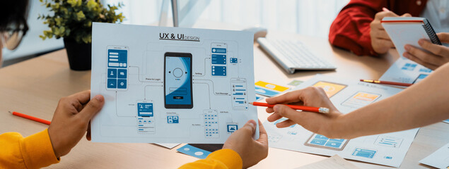 Panorama banner of startup company employee planning on user interface prototype for mobile...