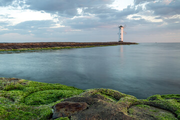 Panoramic image of an old lighthouse in Swinoujscie, a port in Poland on the Baltic Sea.