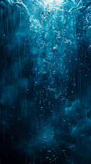 Obraz premium A dark blue water surface with water droplets.