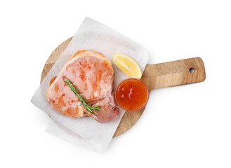 Board with raw meat, marinade, lemon and rosemary isolated on white, top view
