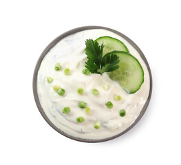 Delicious yogurt with green onion, cucumbers and parsley in bowl isolated on white, top view