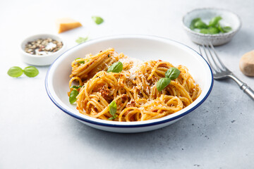 Pasta with red pesto and basil