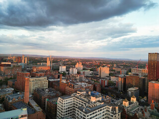 Obraz premium Aerial View of Great Manchester City Centre and Tall Buildings During Golden Hour of Sunset. May 5th, 2024