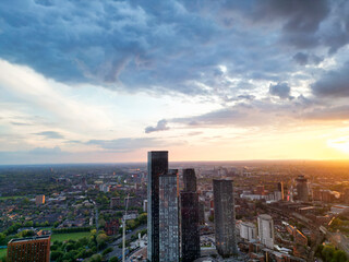 Obraz premium Aerial View of Great Manchester City Centre and Tall Buildings During Golden Hour of Sunset. May 5th, 2024