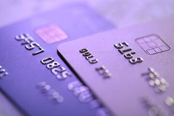 Plastic credit cards on table, macro view. Color toned