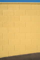 Yellow paint concrete block wall