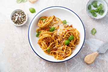 Pasta with red pesto and basil