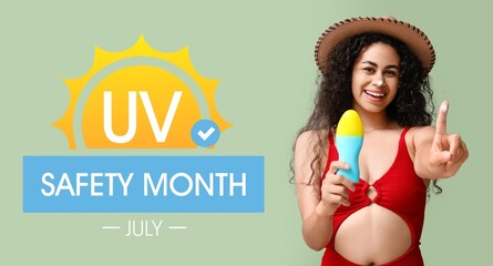 Beautiful young African-American woman with sunscreen cream and text UV SAFETY MONTH - JULY on...