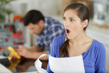 desperate woman banking looking at credit card expenses