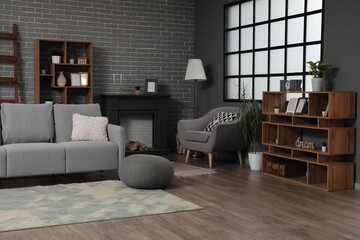 Interior of modern living room with armchair and shelf units