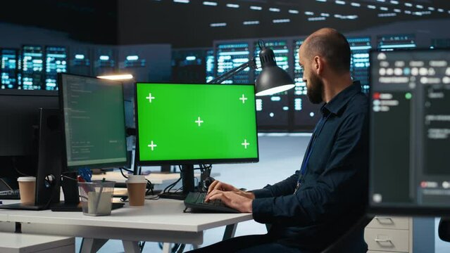 Admin overseeing server room, running code on isolated screen computer display, troubleshooting servers. Technician upgrading hardware clusters and storage arrays using chroma key PC