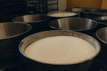 Electric dough mixer machine at the kitchen of bakery. It is mixing sourdough.