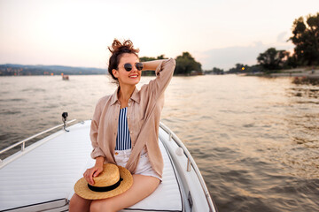 Woman relaxing while sailing on a boat