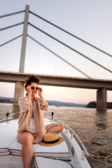 Woman enjoying and relaxing while sailing on a boat