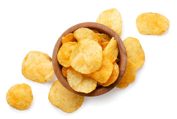 Potato chips in a wooden plate and scattered on a white background. Top view