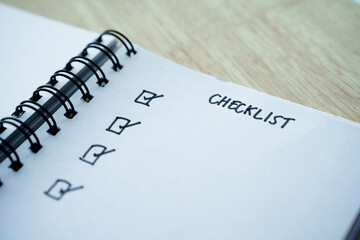 Checklist, Task list, Goal, to do list and reminder concept. Checklist task on notebook.