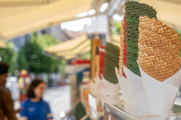 empty ice cream cones assortment collection at shop on a street, Empty ice cream waffle or wafer cones
