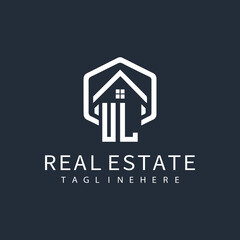 initial monogram logo for real estate with building shape creative design	
