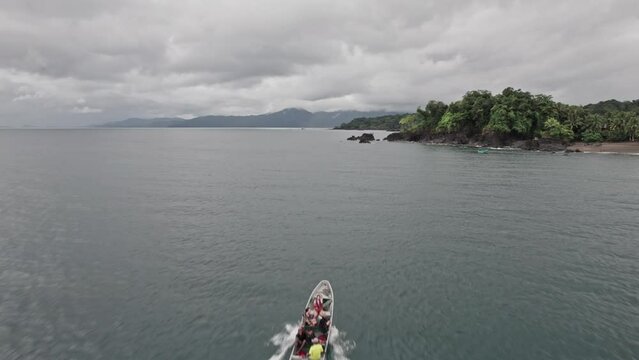 Tourists cruising in a boat among paradisiacal islands
