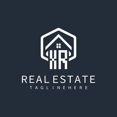 initial monogram logo for real estate with building shape creative design	
