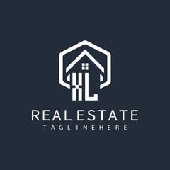 initial monogram logo for real estate with building shape creative design	
