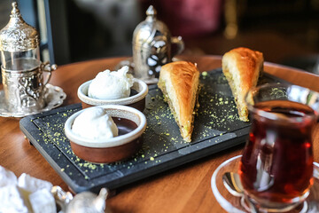 Wooden Table Set With Plates of Delicious Food